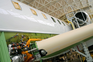 Airplane with cables getting worked on Serving the aerospace industry